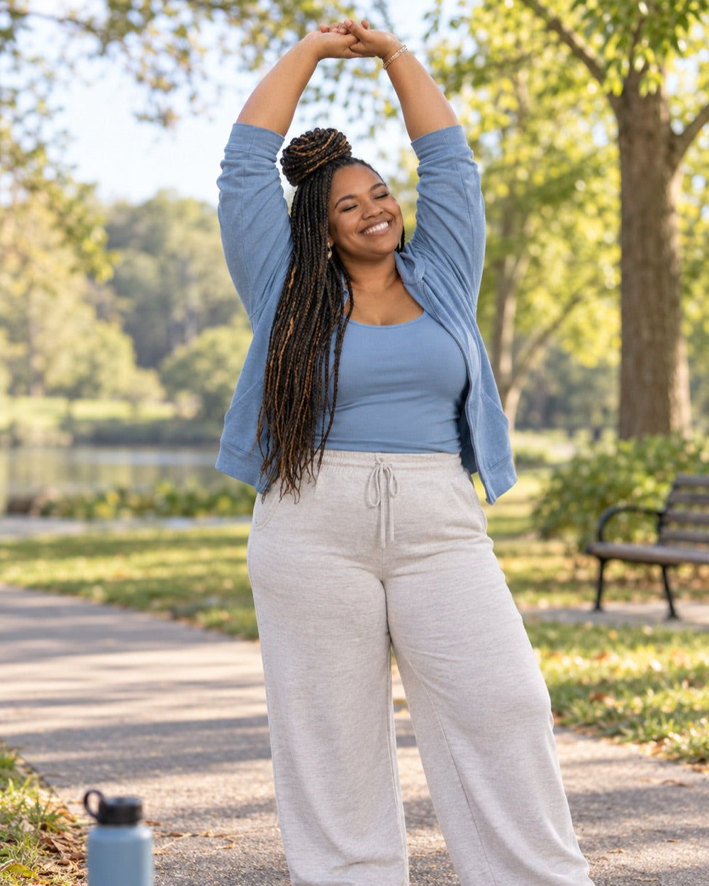A woman stretching on a morning walk in the park